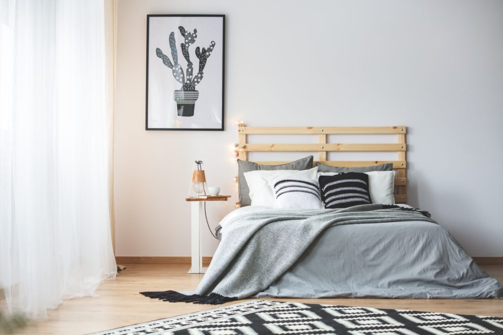 Charming Bedroom Corner with Large Window and Cactus Wall Poster