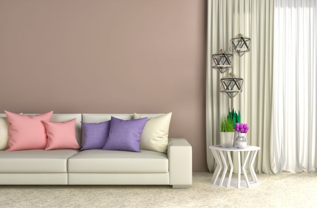 Fashionable Brown Wall Living Room with White Sofa and Beautiful Silk Pillows