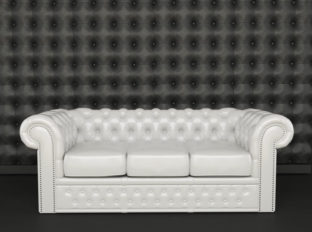 Low-Back Stylish White Leather Sofa with Decorative Tufting and Studs