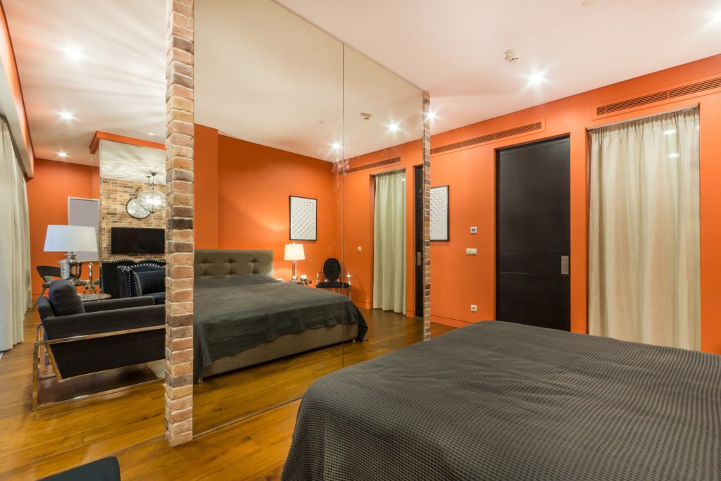 Orange Walls Bedroom with King-Size Bed