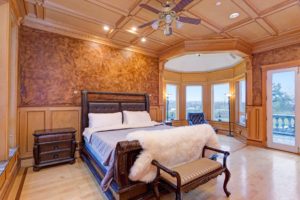 Elegant Mansion Bedroom with Wood Coffered Ceiling and Beautiful Reading Nook