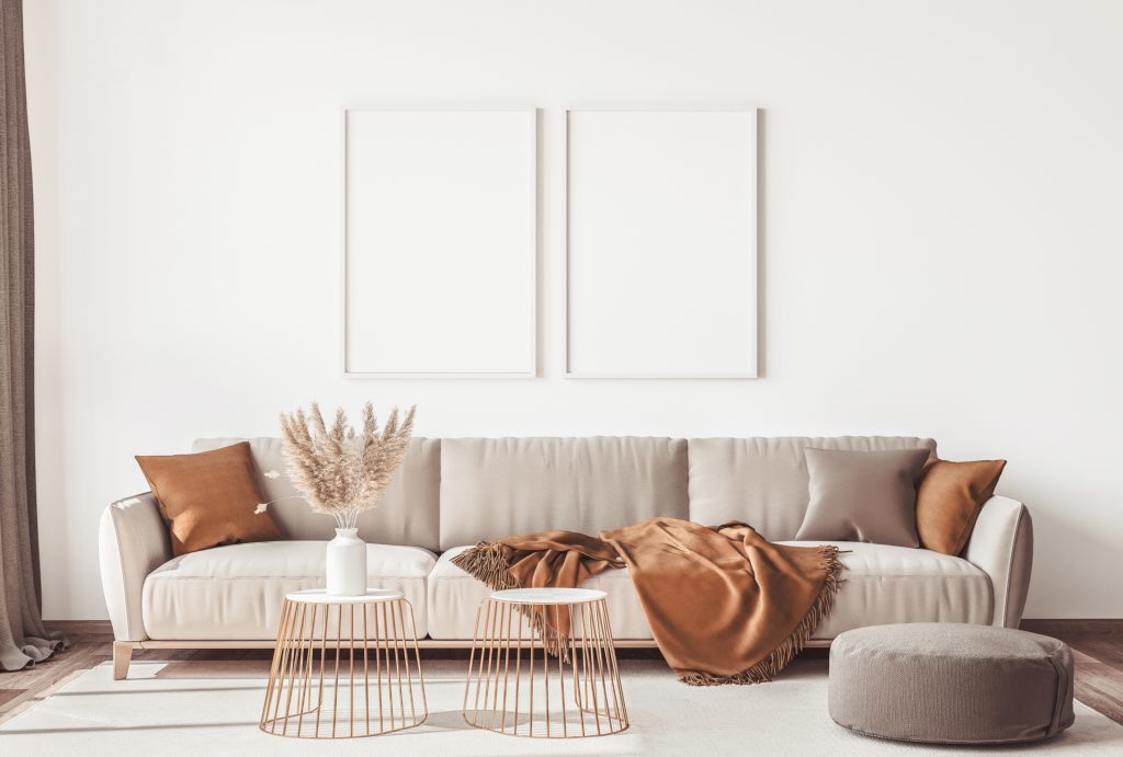 Long Beige Couch with Rich Cocoa Orange and Beige Pillows