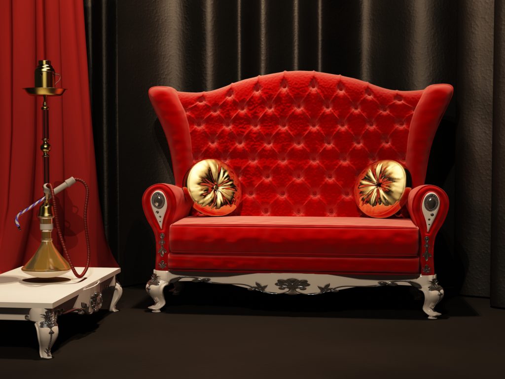 Vintage Style High Backed Red Sofa with Gold Pillows and Decorative Hookah