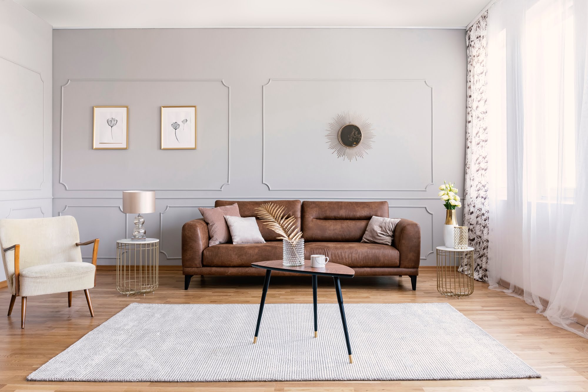 brown leather sofa grey rug