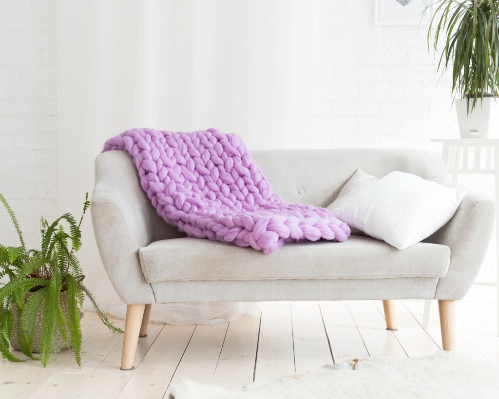 Purple Blanket on Gray Sofa