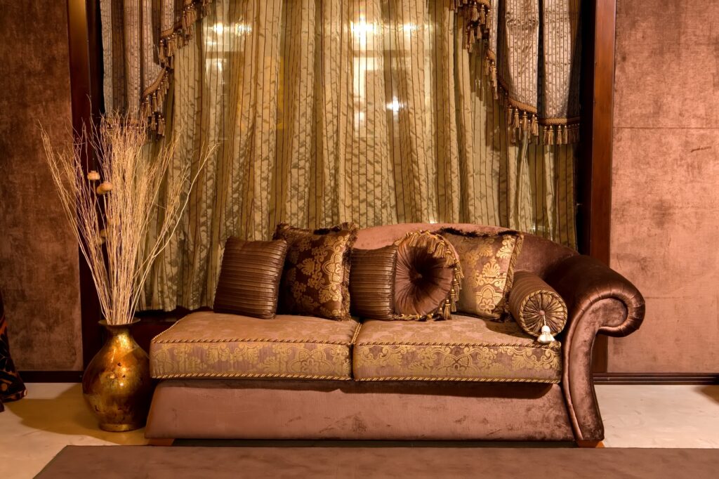 Shabby Chic Interior with Ornate Brown Sofa and Accessories
