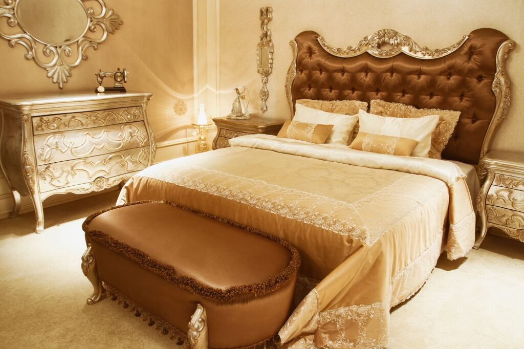 Ornate Brown Shabby Chic Bedroom with Elaborate Gold Details