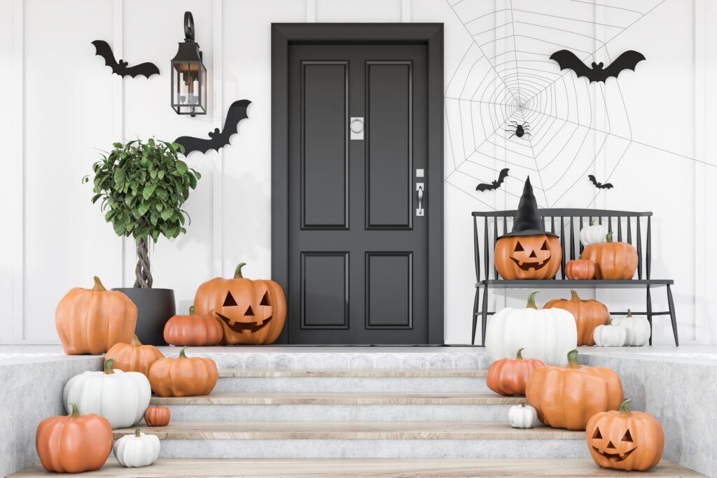 Front Steps of Home with Clusters of Carved Pumpkins for Halloween